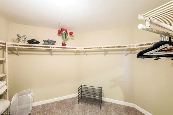 a view of a room with table and chairs