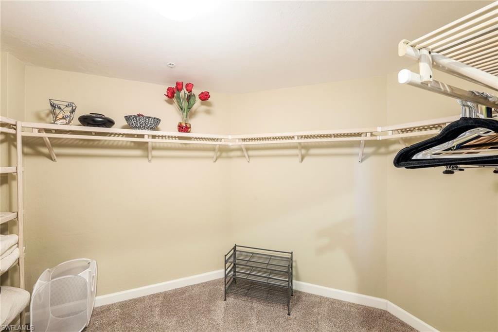 325 Dunes Boulevard, Unit 406 Naples, FL 34110 - Photo 11 of 21 a view of a room with table and chairs