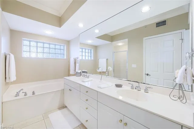 a bathroom with a double vanity sink mirror and double