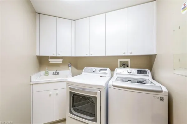 a utility room with dryer and washer