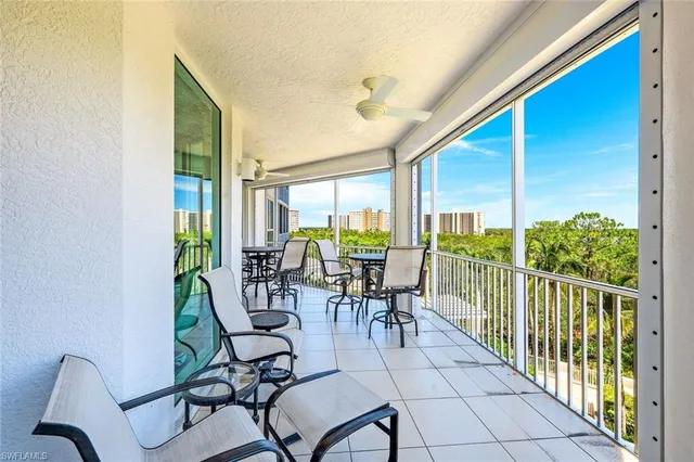 a view of a city from a dining room with furniture window and outside view