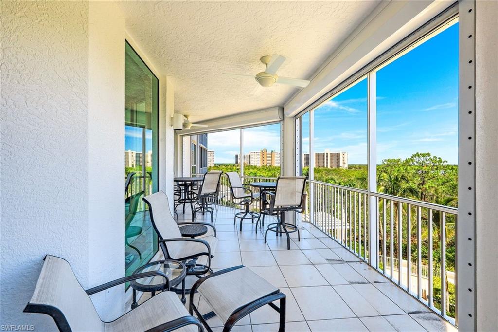 325 Dunes Boulevard, Unit 406 Naples, FL 34110 - Photo 20 of 21 a view of a city from a dining room with furniture window and outside view