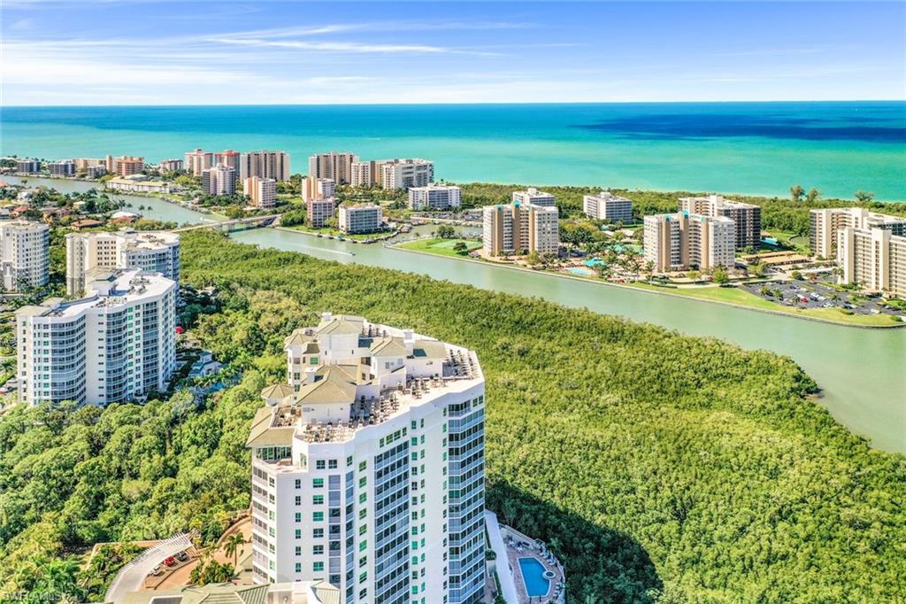 325 Dunes Boulevard, Unit 406 Naples, FL 34110 - Photo 2 of 21 a view of a city and ocean view