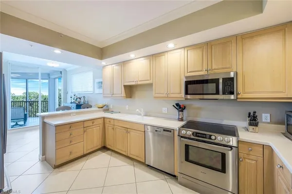 a kitchen with a sink stove and microwave