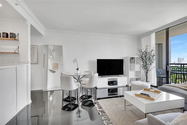 a living room with furniture and a flat screen tv