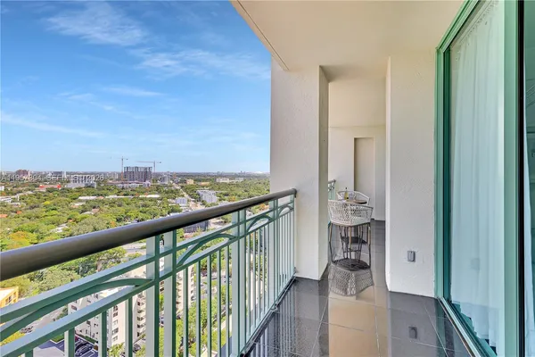 a view of balcony with furniture