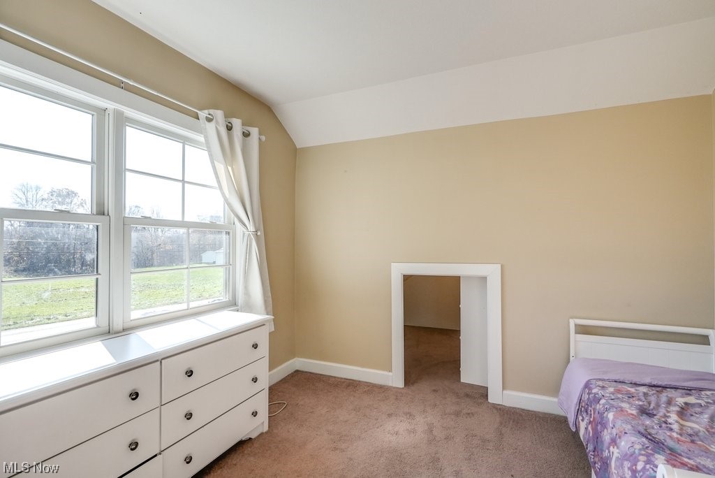 3417 Lake Rockwell Road Ravenna, OH 44266 - Photo 20 of 35 bedroom with lofted ceiling and light colored carpet