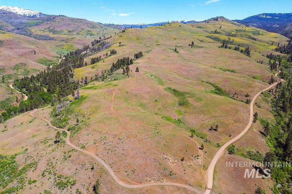 255-ac Fall Creek Road Council, ID 83612 - Photo 24 of 50 Aerial view of property and surrounding area with a mountainous background
