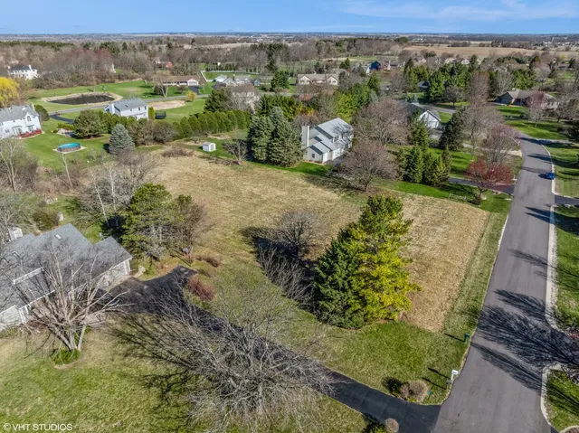 a view of a city with lush green forest