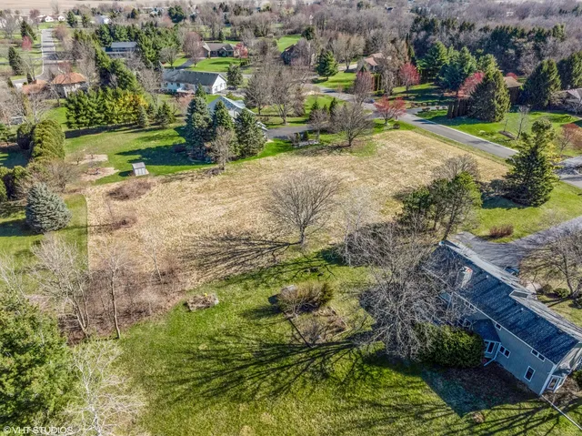 an aerial view of residential house with outdoor space