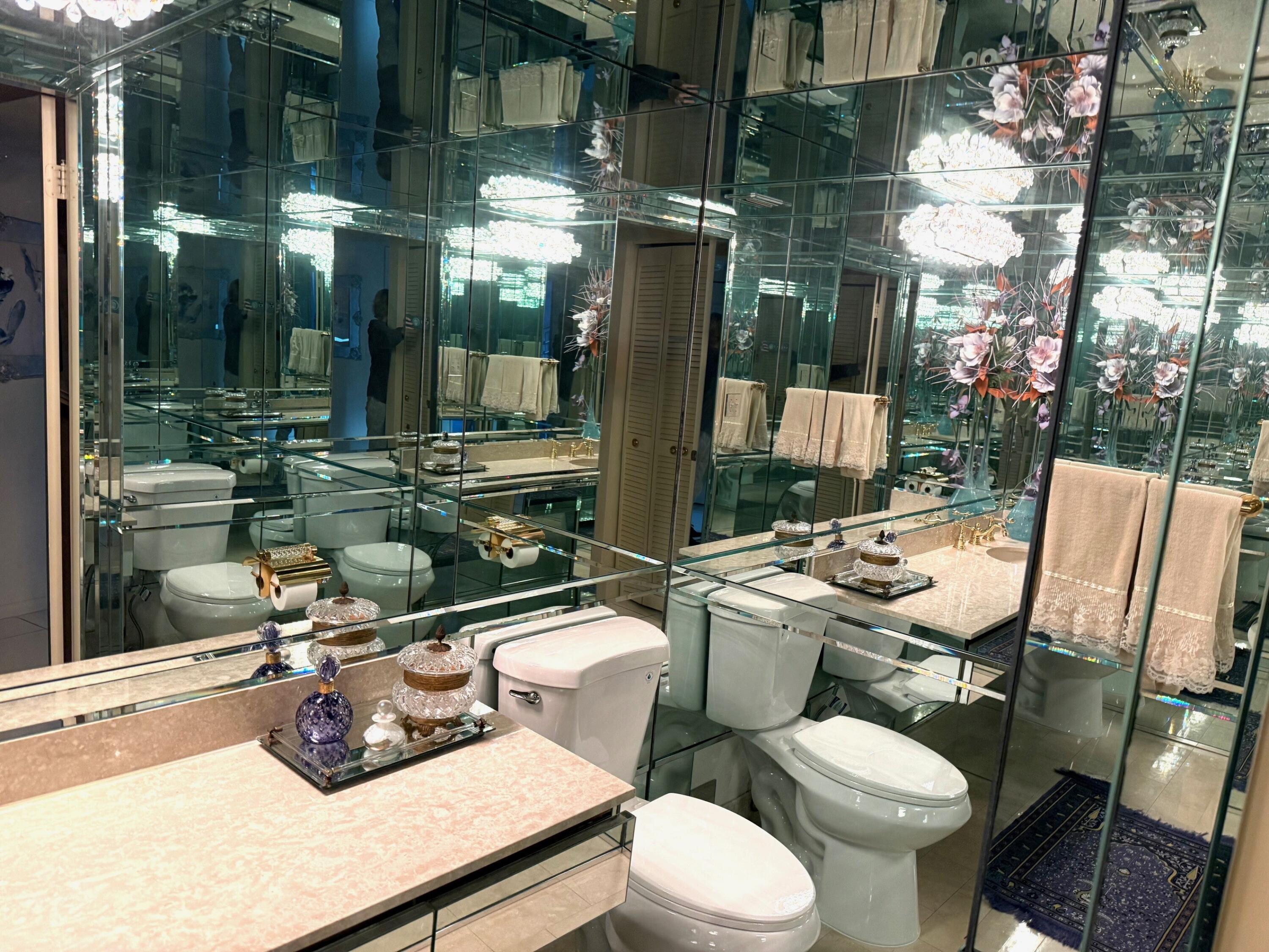 7564 Regency Lake Drive, Unit 702 Boca Raton, FL 33433 - Photo 28 of 40 a view of a patio with chairs and potted plants