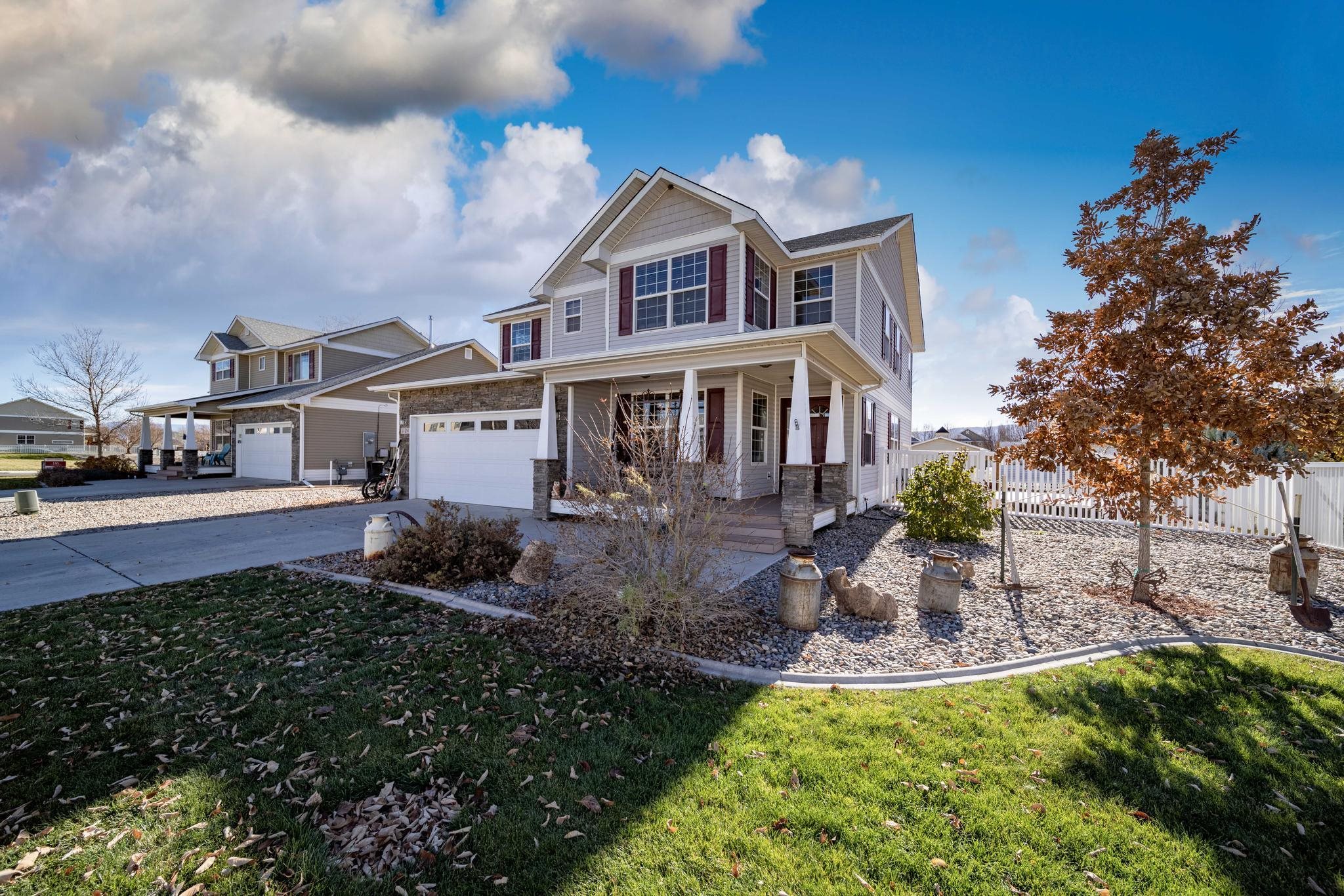 1124 West Addington Lane Fruita, CO 81521 - Photo 1 of 25 a front view of a house with a yard