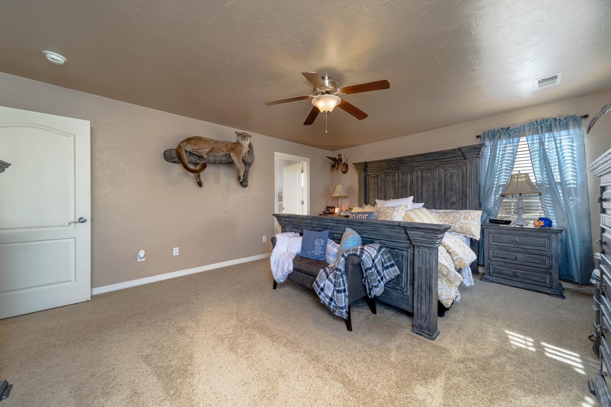 1124 West Addington Lane Fruita, CO 81521 - Photo 13 of 25 a bedroom with furniture and window