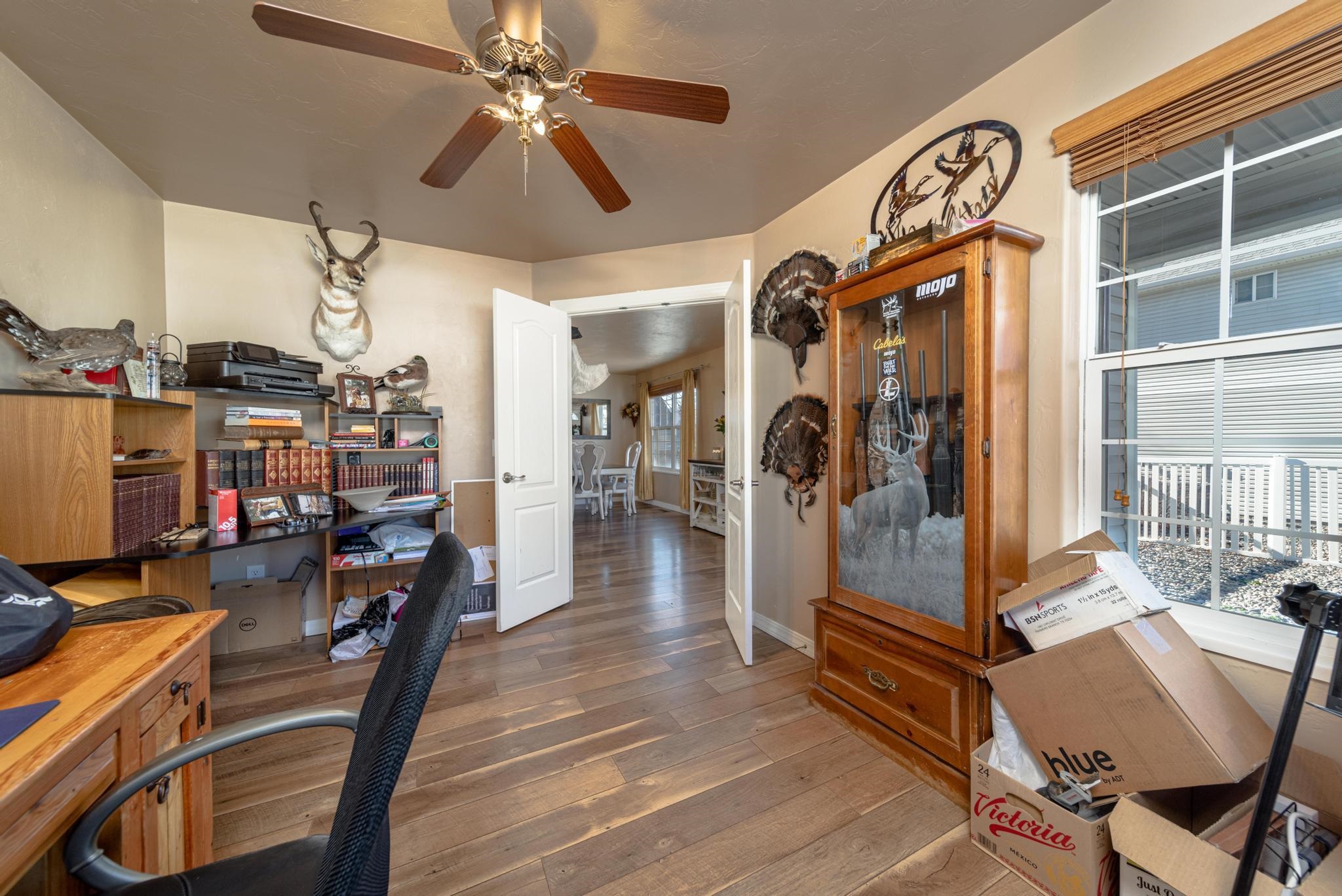 1124 West Addington Lane Fruita, CO 81521 - Photo 20 of 25 a view of a livingroom with furniture and a flat screen tv