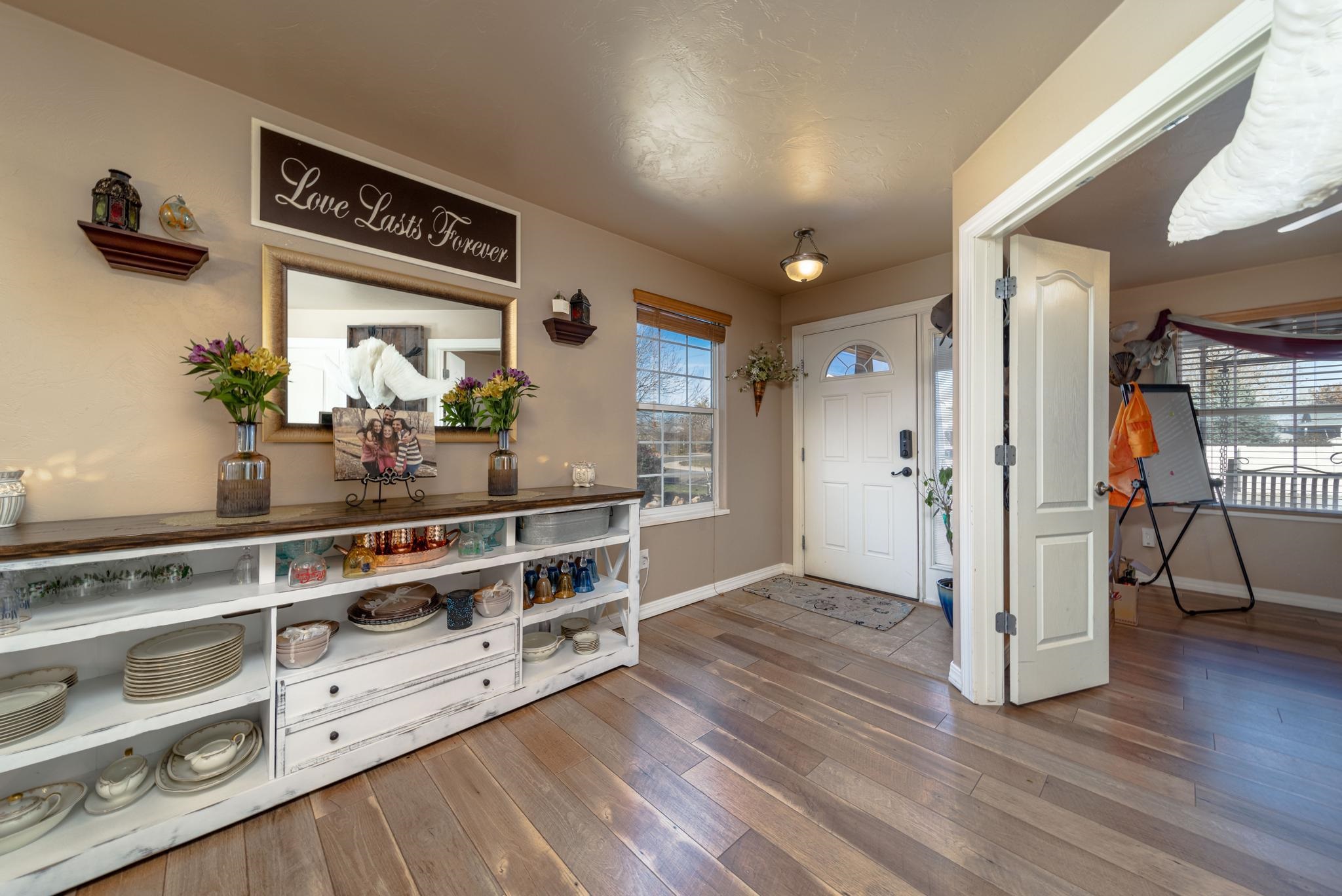 1124 West Addington Lane Fruita, CO 81521 - Photo 7 of 25 a view of kitchen with furniture and wooden floor