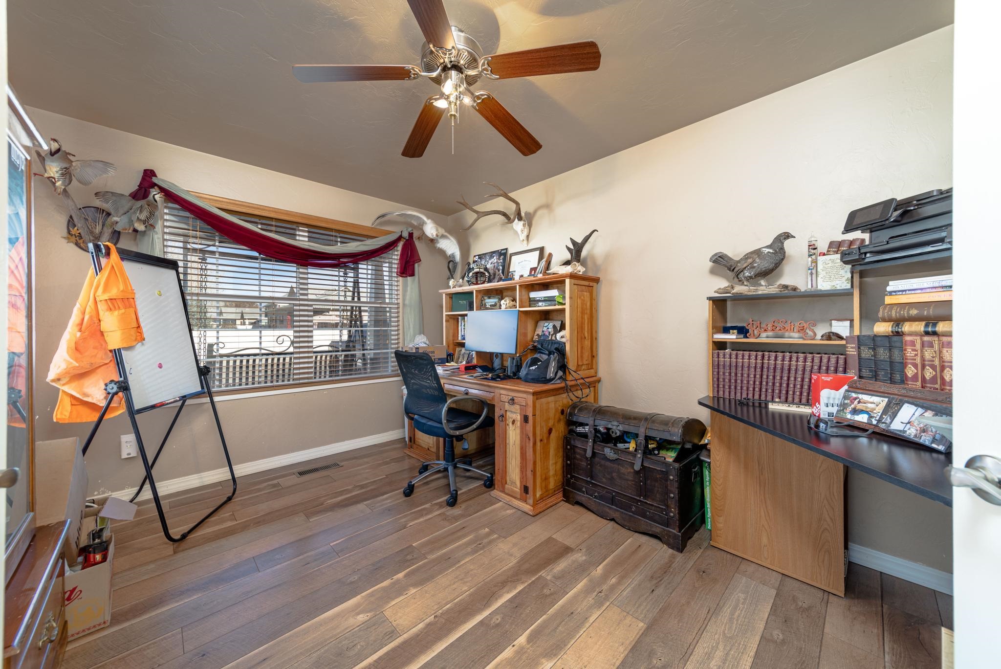 1124 West Addington Lane Fruita, CO 81521 - Photo 9 of 25 a view of a workspace with furniture and a window
