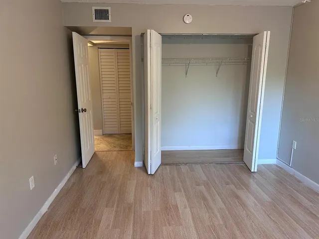 a bathroom with a sink and mirror with toilet