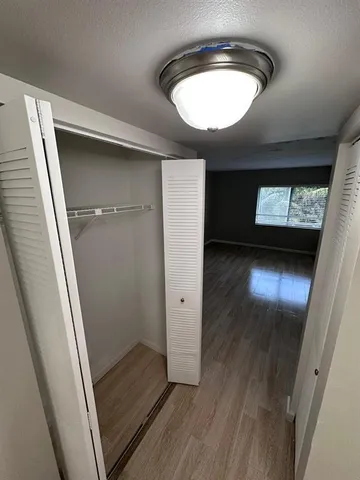 a view of a room with a hardwood