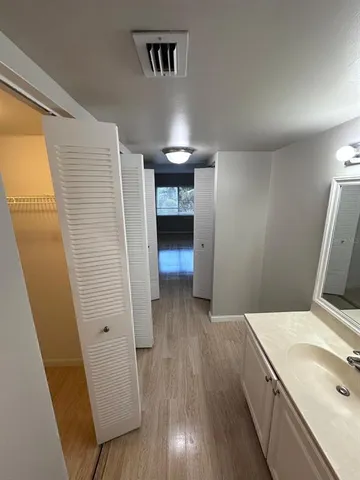 a kitchen with stainless steel appliances granite countertop a stove sink and cabinets