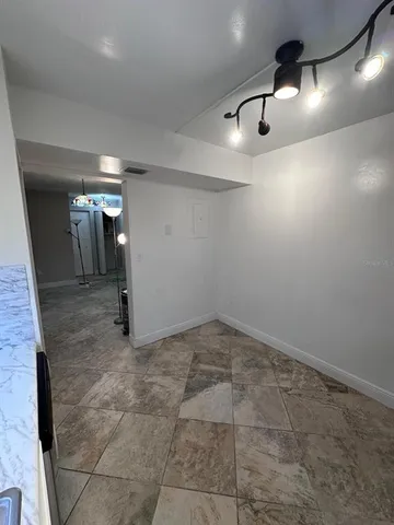 a view of an empty room with a window