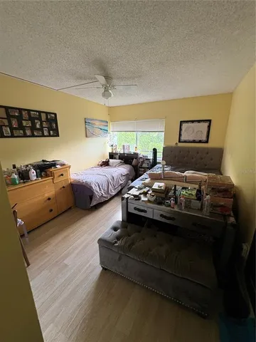 a bathroom with a sink a toilet a mirror and shower