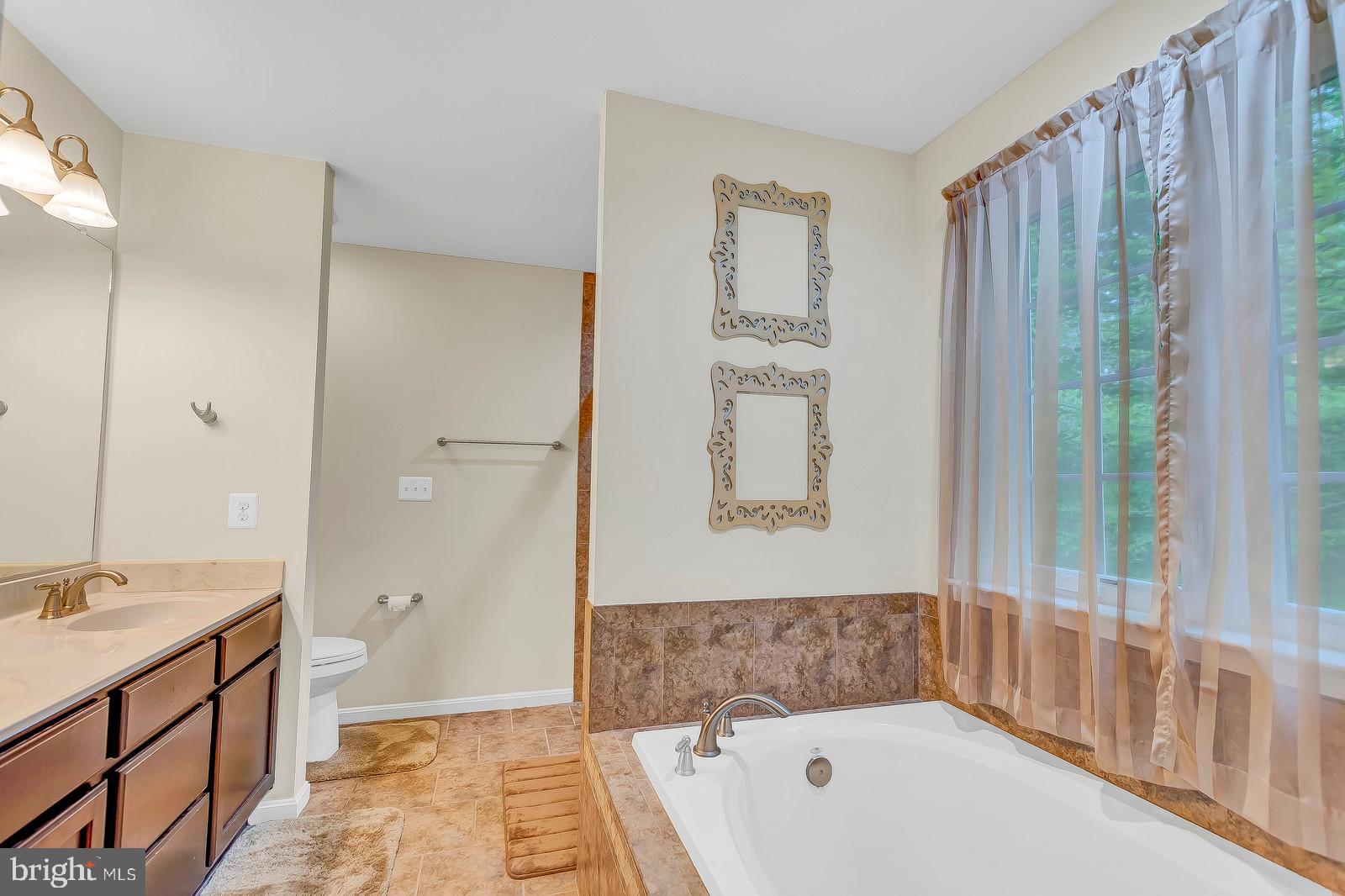 1849 Lottie Fowler Road Prince Frederick, MD 20678 - Photo 16 of 41 Master Bathroom with tub and tiled shower