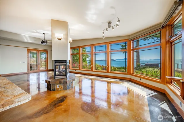 a view of an entryway with wooden floor and windows