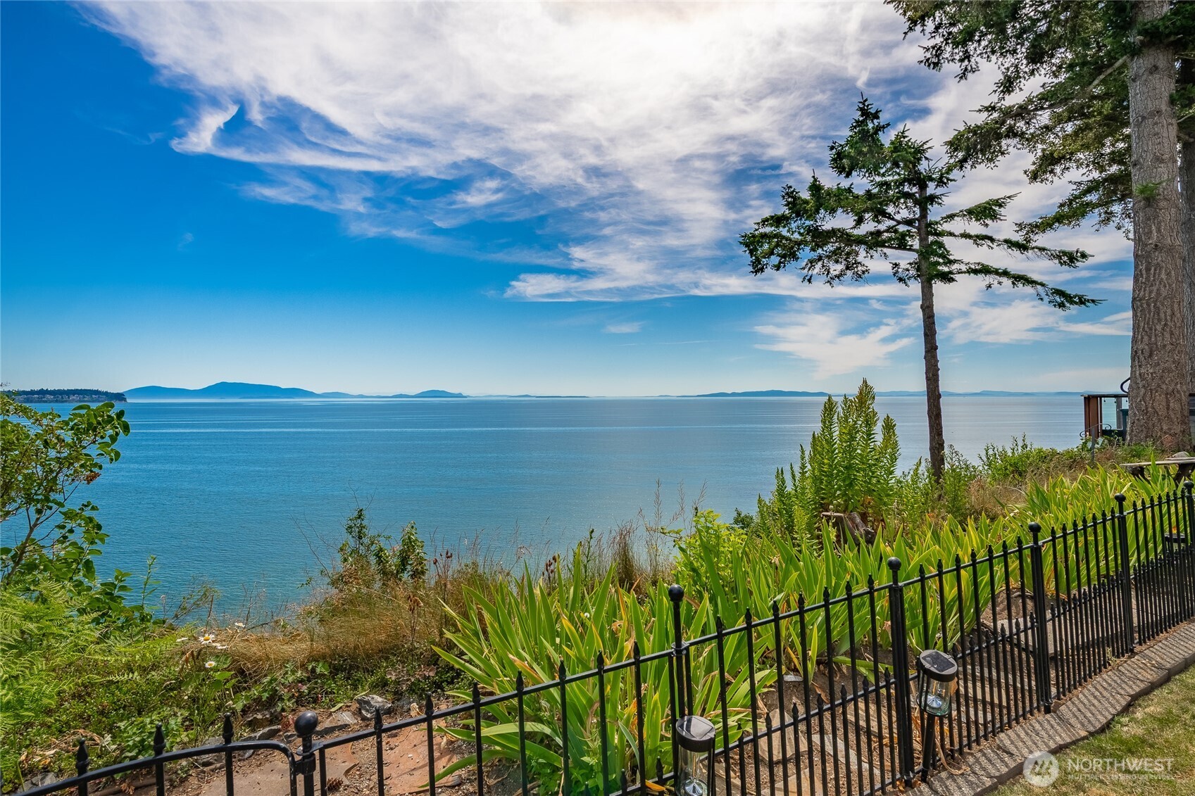 5727 Nakat Way Blaine, WA 98230 - Photo 3 of 40 a view of a lake with a garden