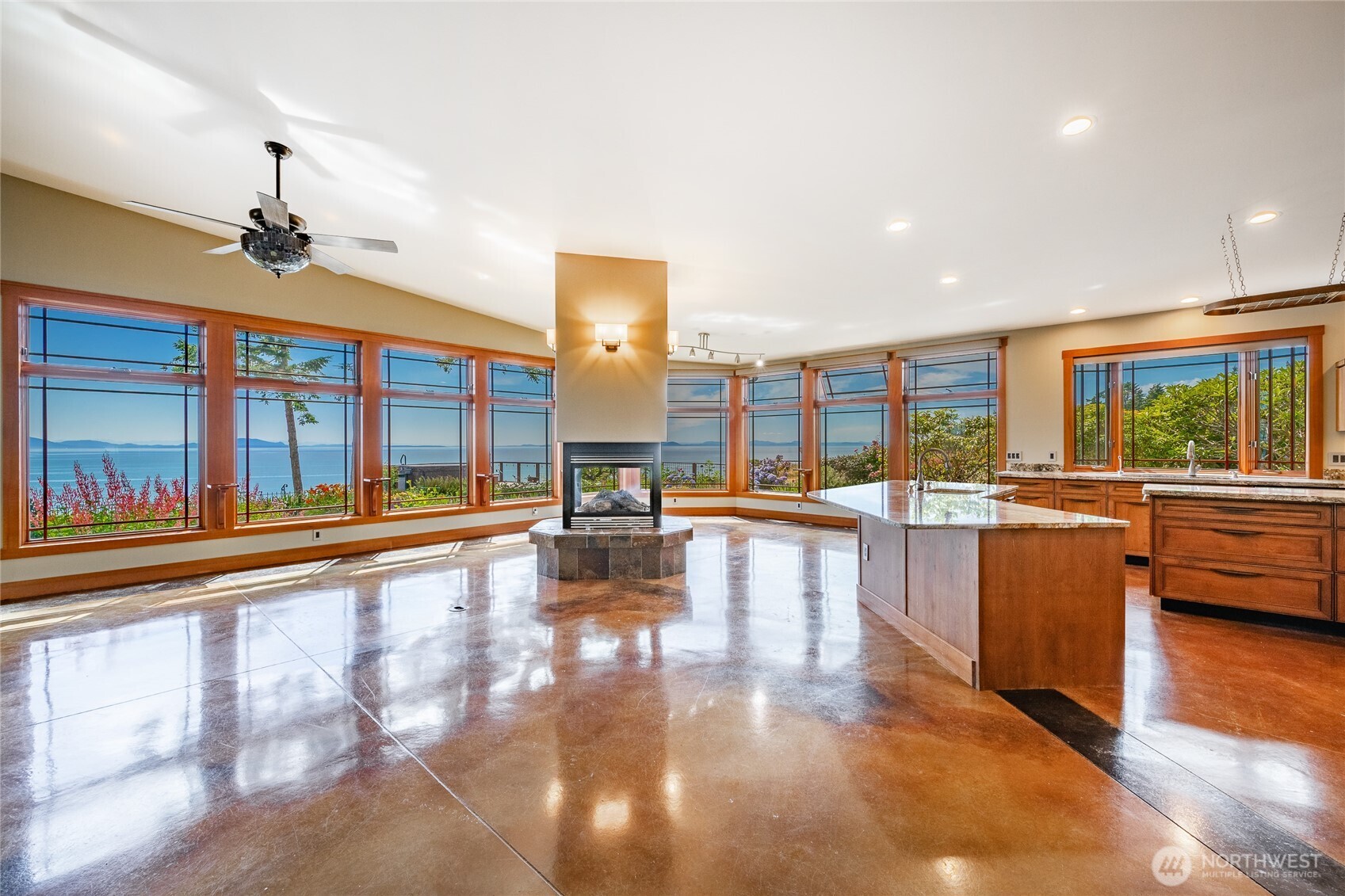 5727 Nakat Way Blaine, WA 98230 - Photo 8 of 40 a view of a living room and kitchen with a large window