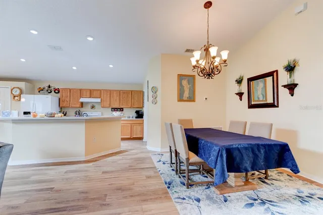 a kitchen with a table and chairs in it