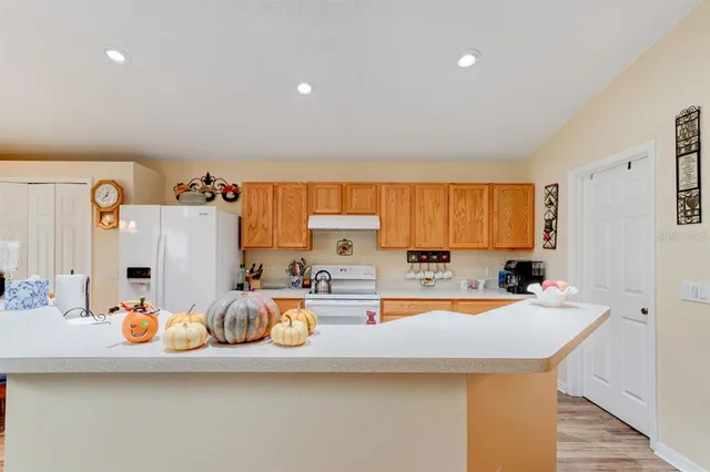 a kitchen with a sink a stove and cabinets