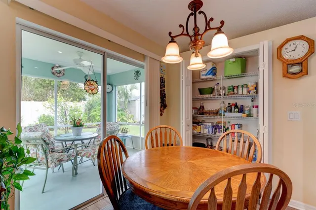 a view of a dining room with furniture window and outside view