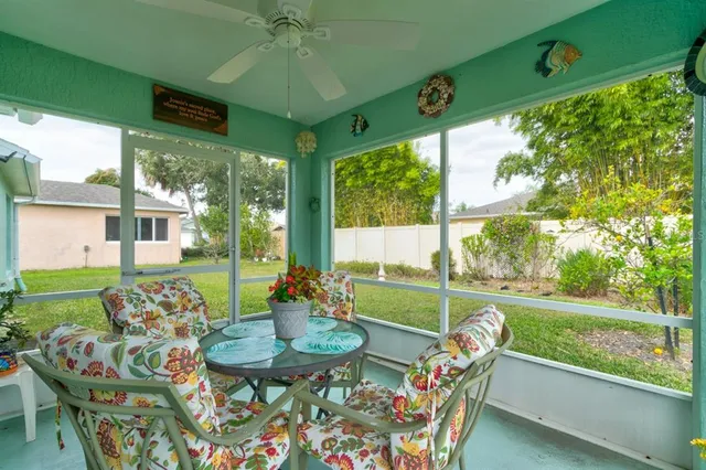 a front view of a house with garden and patio
