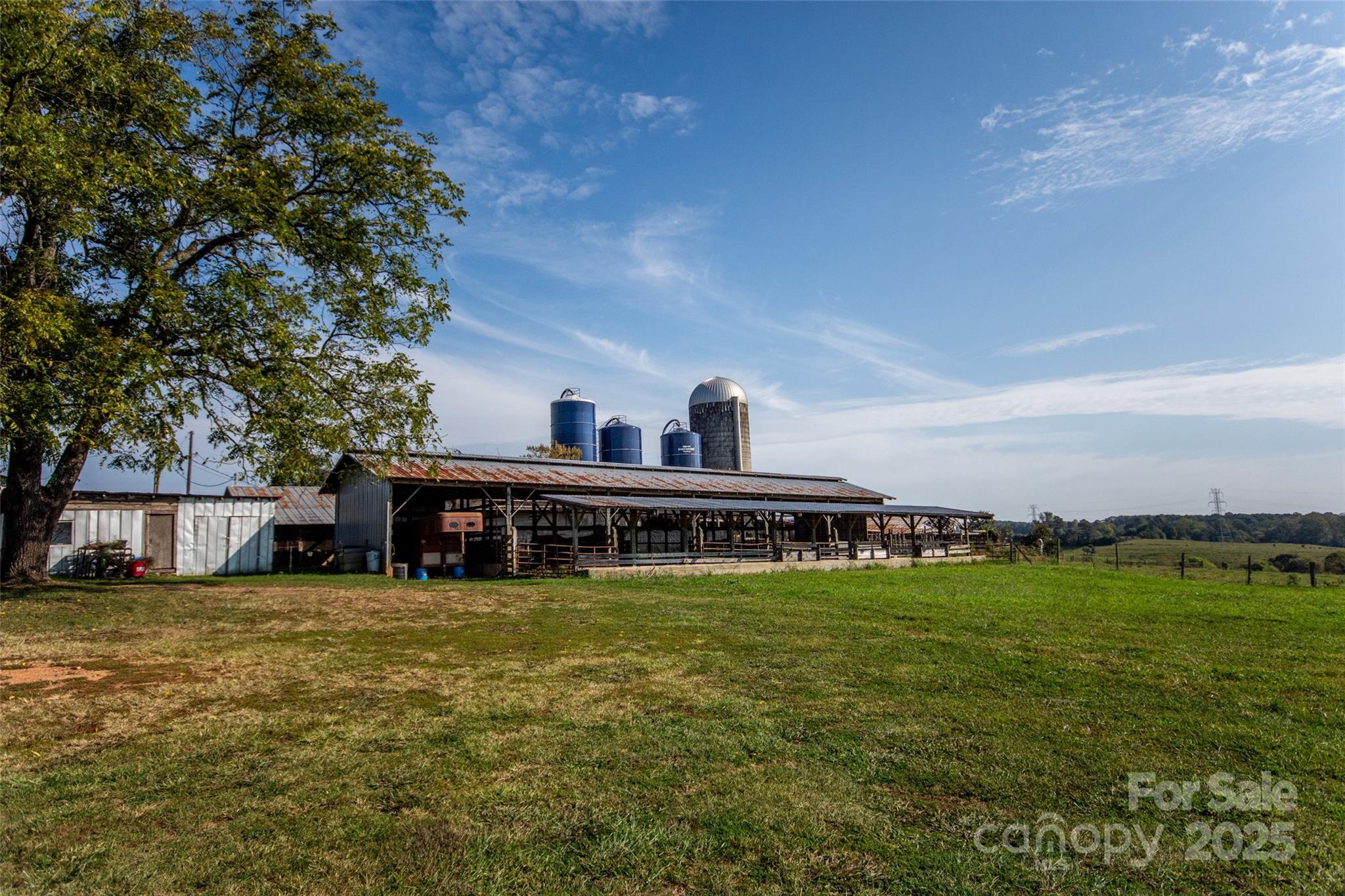 334 Myers Mill Road Statesville, NC 28625 - Photo 23 of 35 a view of a swimming pool with lawn chairs and large trees
