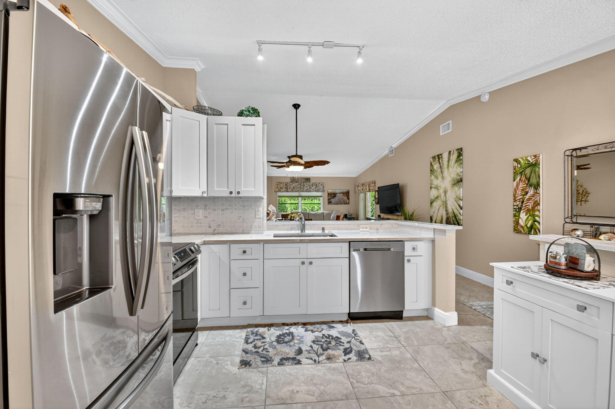 6426 Mill Pointe Circle Delray Beach, FL 33484 - Photo 11 of 57 a kitchen with white cabinets and refrigerator