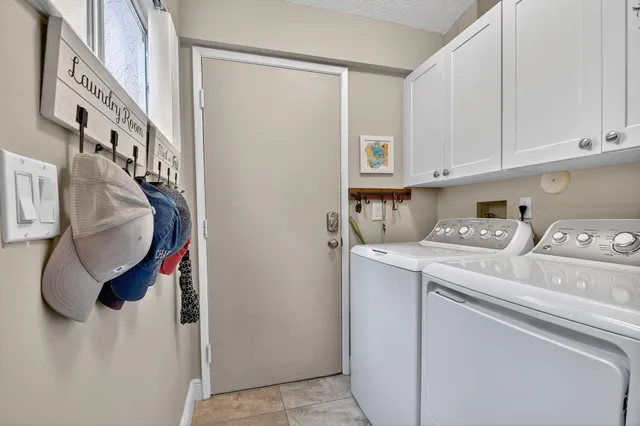 a bedroom with a bed and flat screen tv
