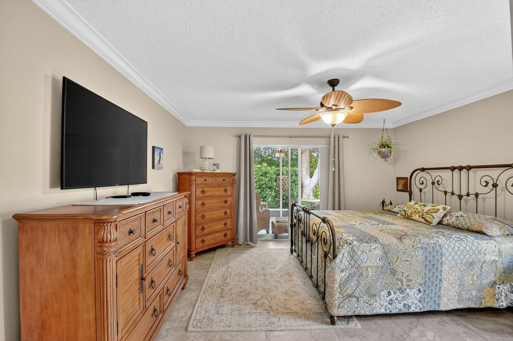 6426 Mill Pointe Circle Delray Beach, FL 33484 - Photo 15 of 57 a bedroom with a bed and flat screen tv