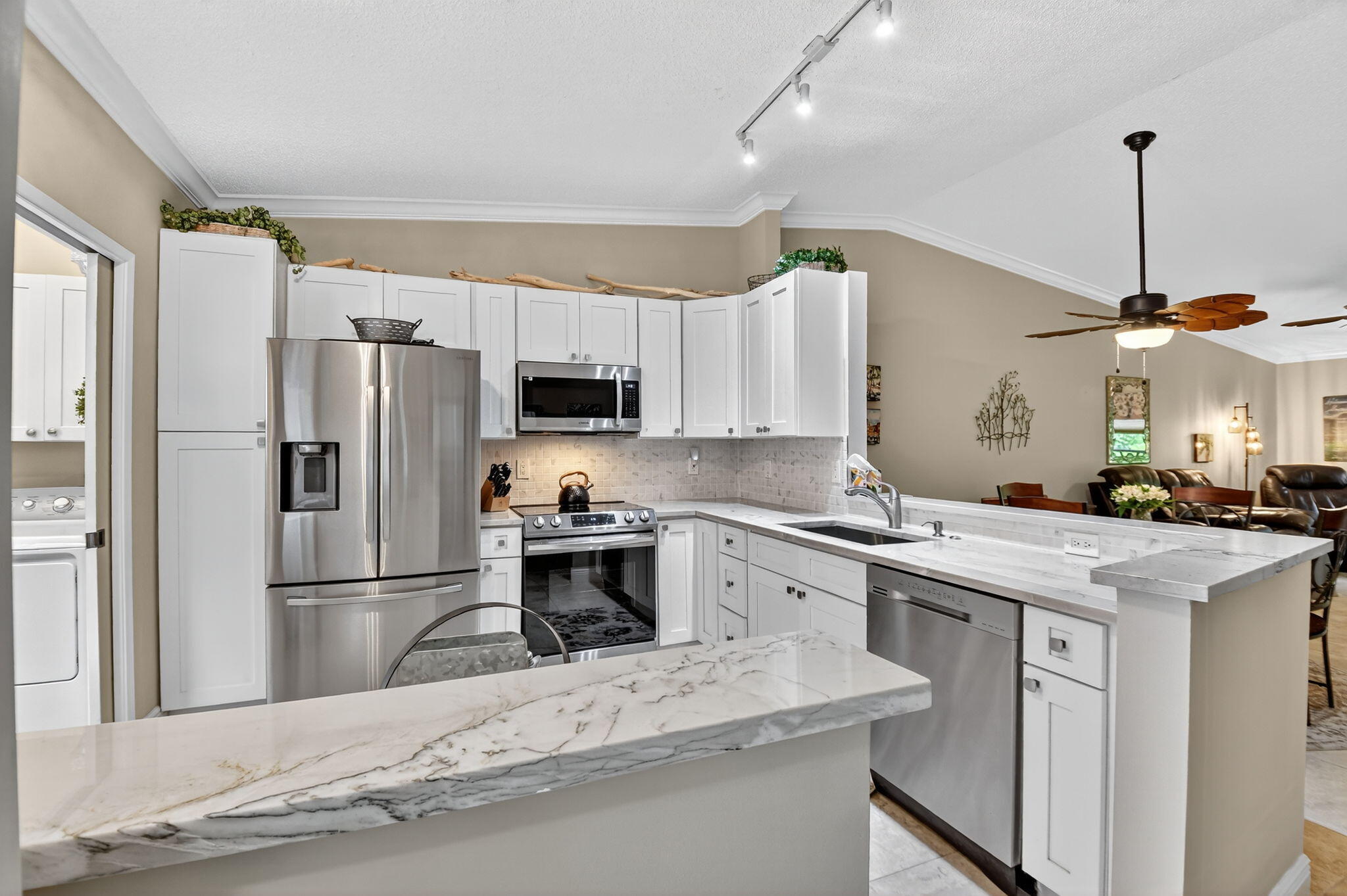 6426 Mill Pointe Circle Delray Beach, FL 33484 - Photo 2 of 57 a kitchen with a refrigerator a sink and a oven