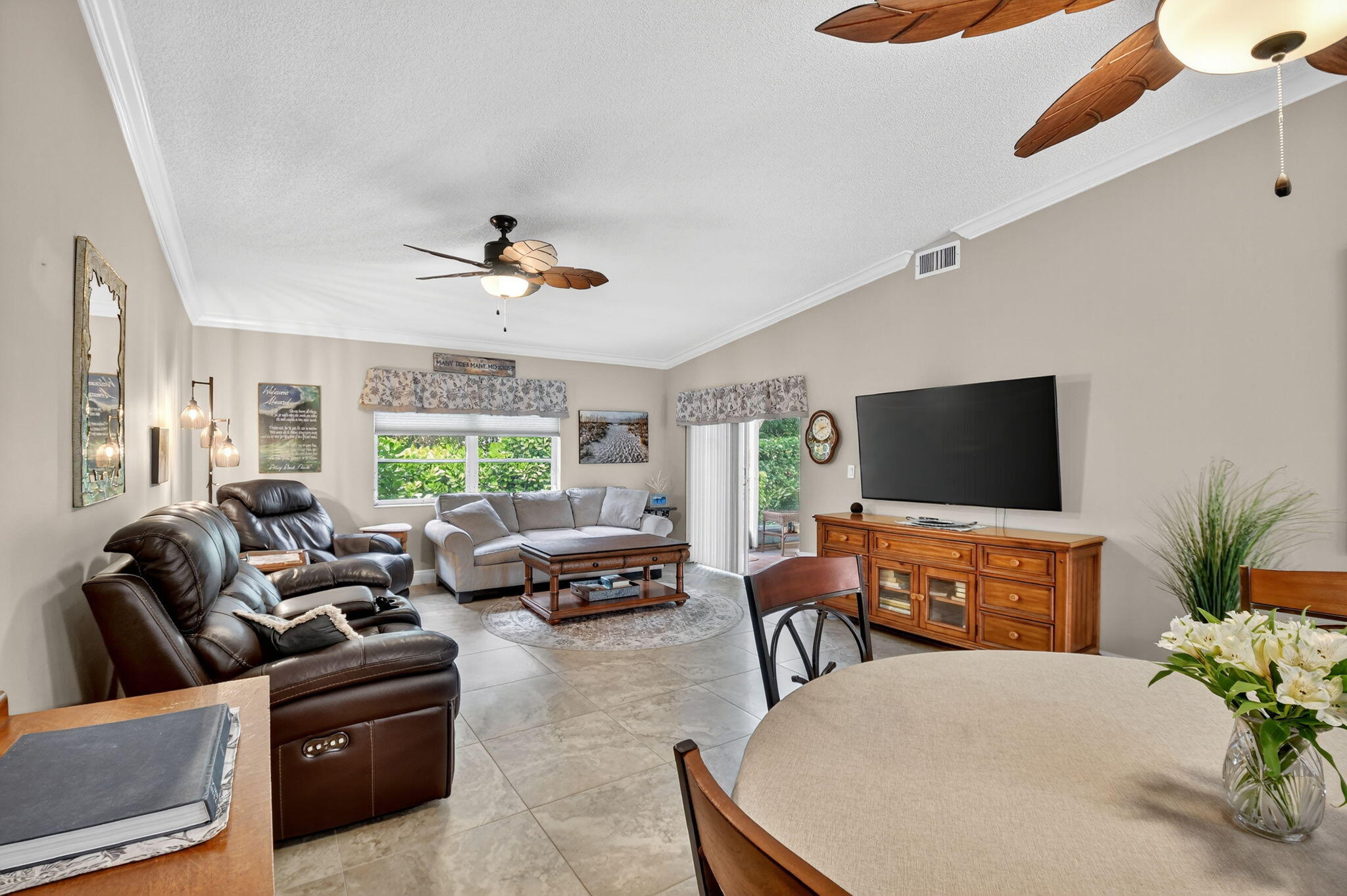 6426 Mill Pointe Circle Delray Beach, FL 33484 - Photo 7 of 57 a living room with furniture and a flat screen tv