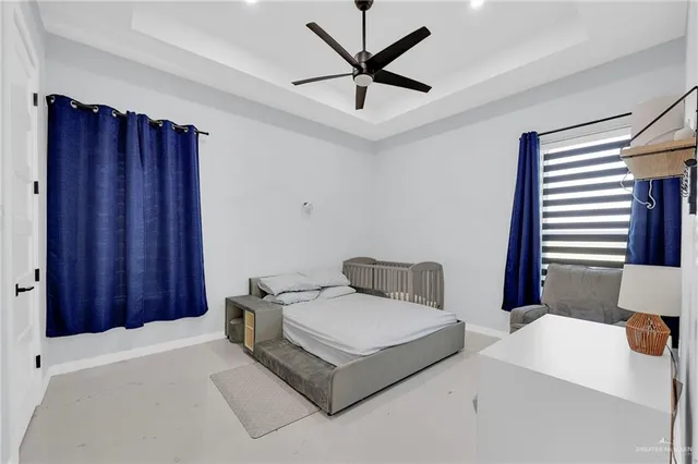 a bathroom with a tub sink toilet and a mirror