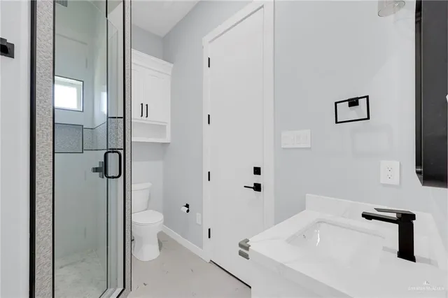 a view of cabinets a washer and dryer