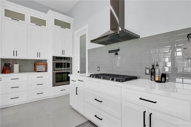 a living room with furniture a ceiling fan and a rug