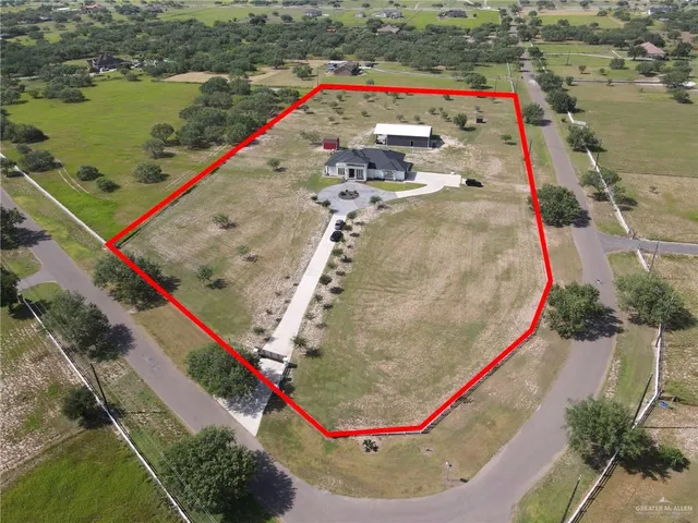 a bird view of house with outdoor space