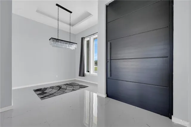 a kitchen with stainless steel appliances granite countertop a refrigerator and a stove