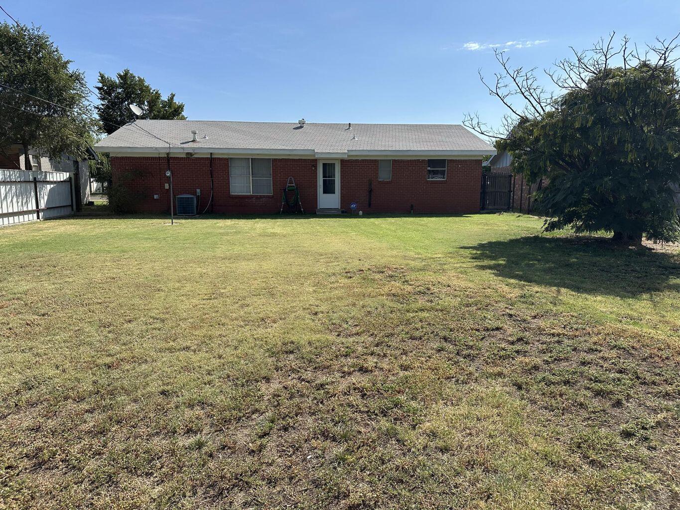 2807 Lexington Street Plainview, TX 79072 - Photo 16 of 16 a front view of a house with a yard
