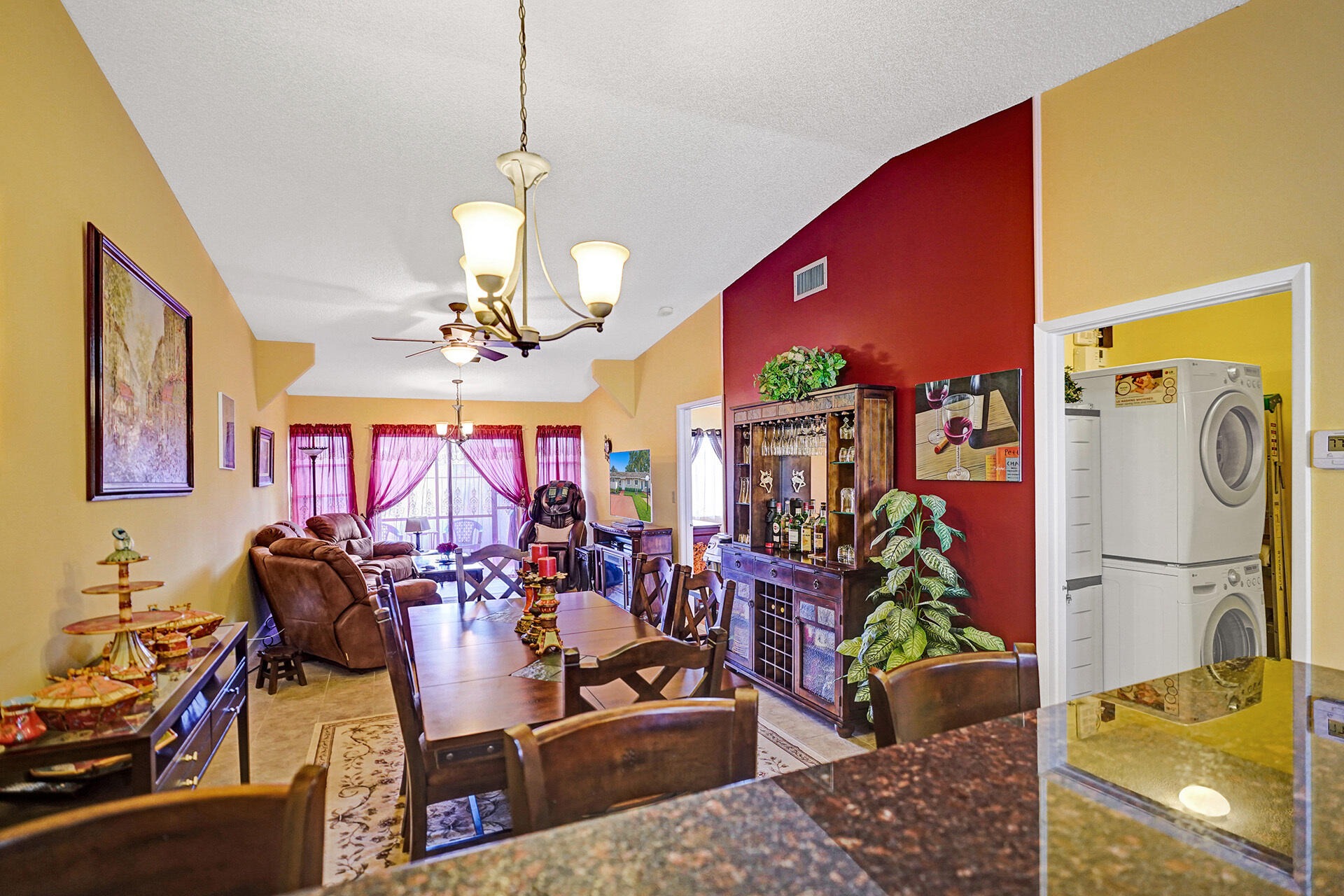 8624 Overset Lane, Unit B Boca Raton, FL 33496 - Photo 16 of 29 a view of a dining room with furniture and a chandelier