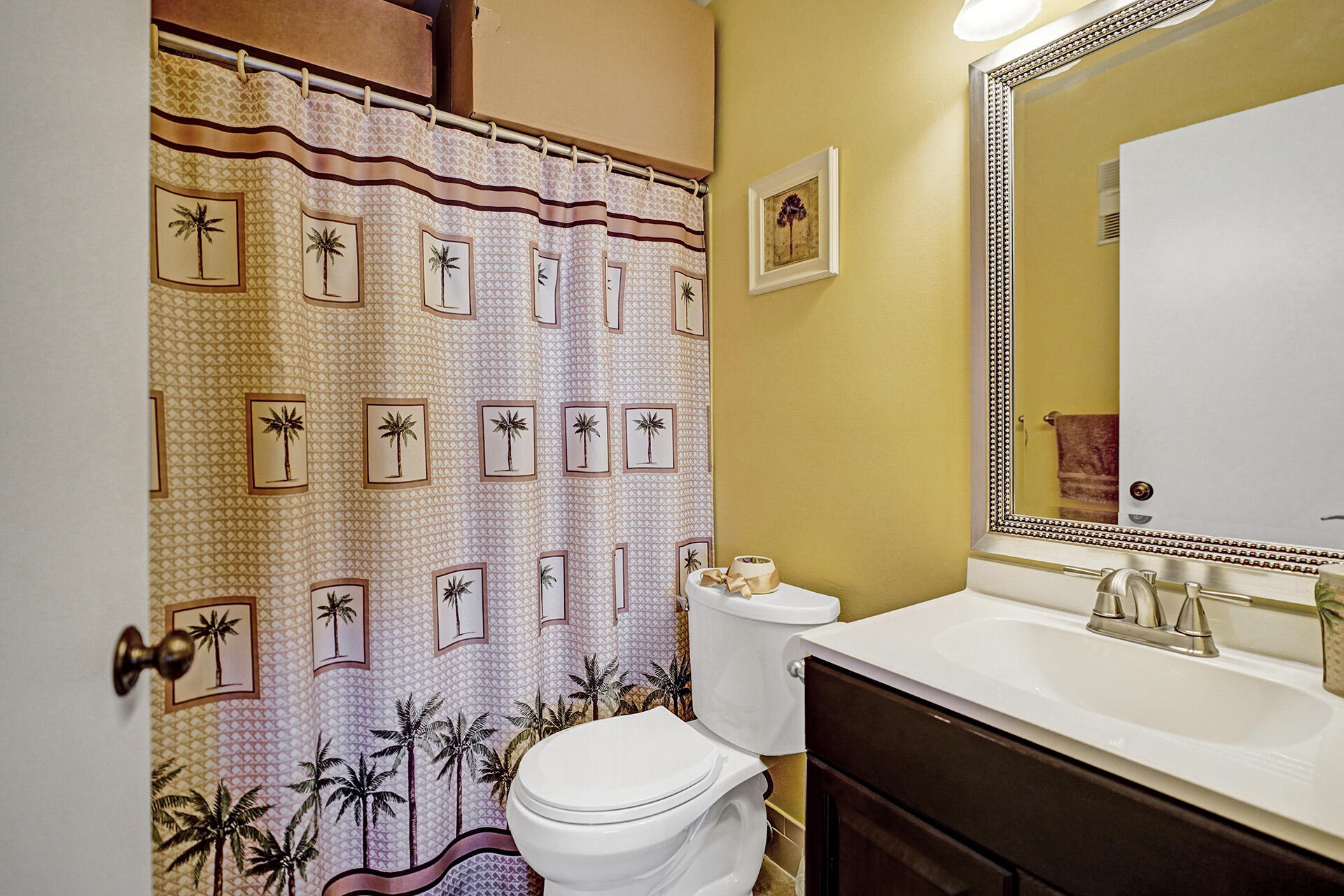 8624 Overset Lane, Unit B Boca Raton, FL 33496 - Photo 22 of 29 a bathroom with a sink a toilet a mirror and shower