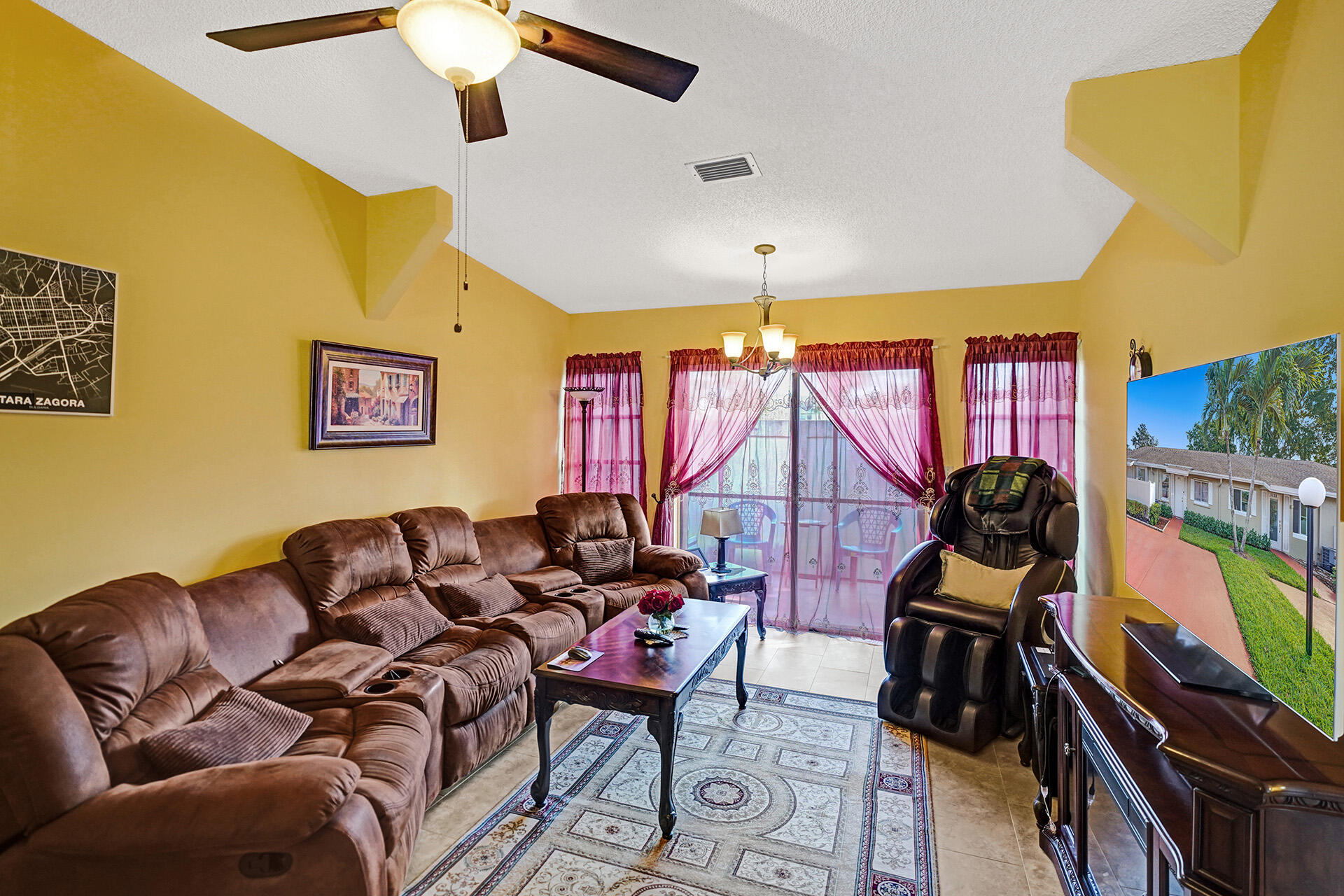 8624 Overset Lane, Unit B Boca Raton, FL 33496 - Photo 7 of 29 a living room with furniture a rug and a chandelier