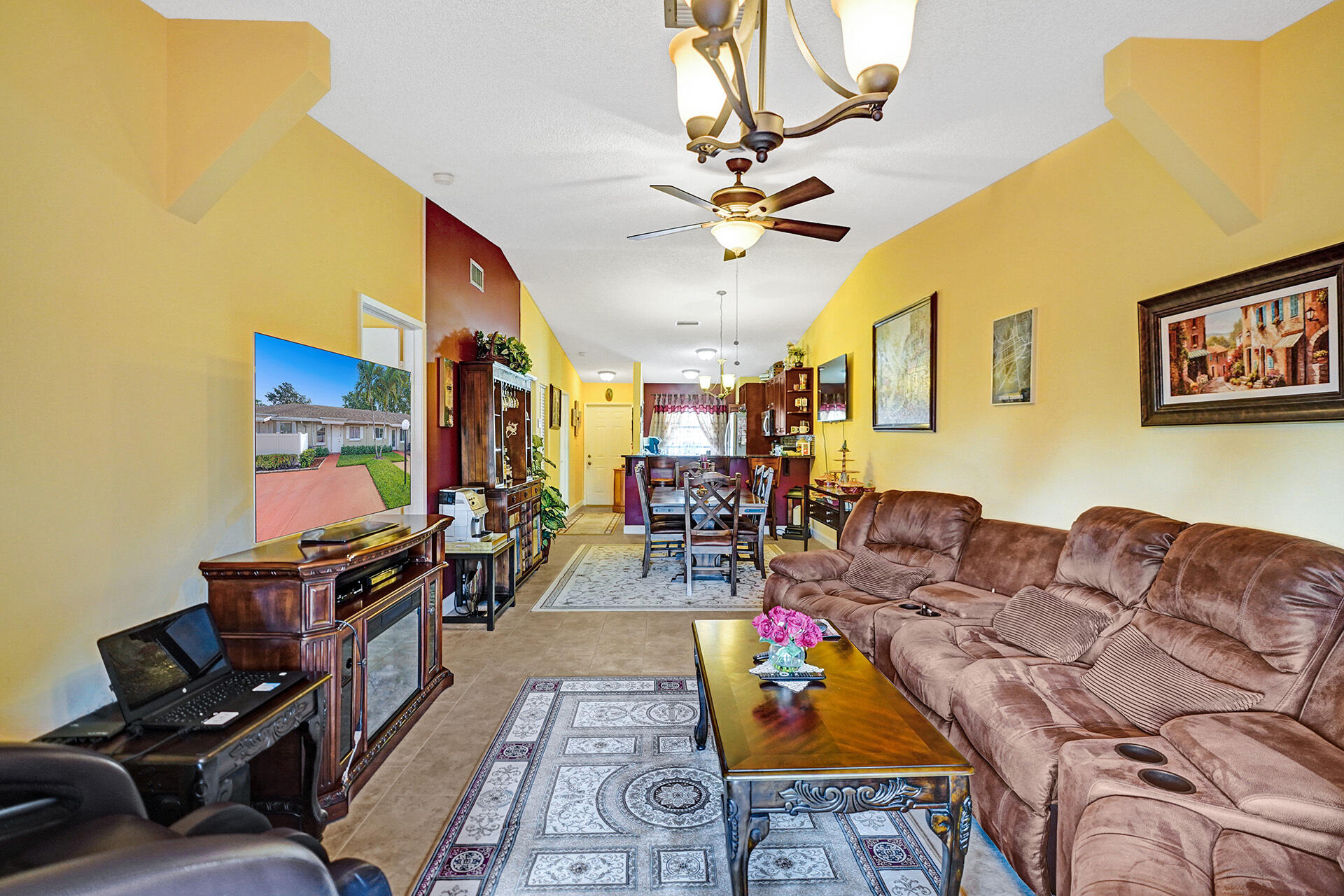 8624 Overset Lane, Unit B Boca Raton, FL 33496 - Photo 10 of 29 a living room with furniture and a chandelier