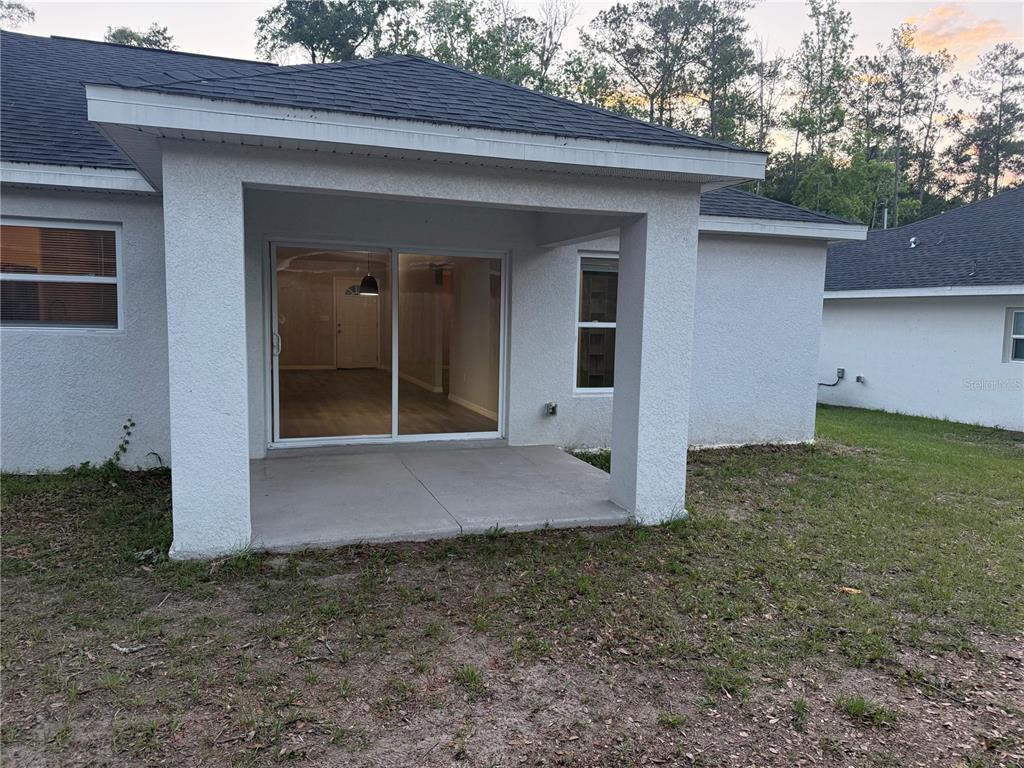 12847 Southwest 84th Terrace Road Ocala, FL 34473 - Photo 16 of 16 a front view of a house with a yard